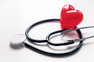 Medical Stethoscope and red glossy heart