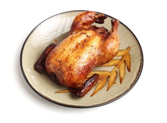 Whole roasted chicken against white background