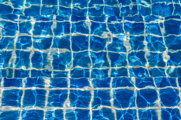 Blue color water in swimming pool rippled