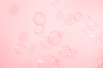 soap bubbles on pink background