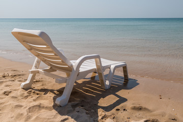 Beach chair at sunny coast at the beach