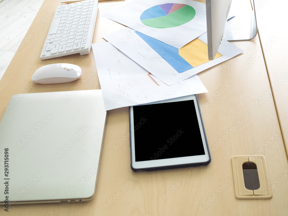 Poster digital work desk with keyboard mouse, pencil paper report chart notebook, tablet computer on a wood
