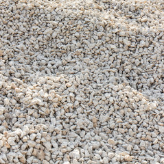 Small stones or rocks on sidewalk as background texture