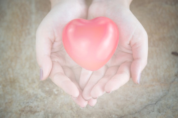 Fototapeta premium Woman hold red heart