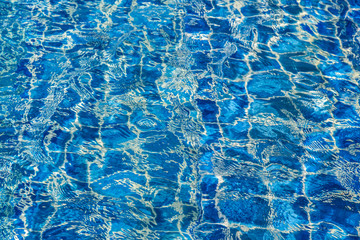 Blue color water in swimming pool rippled