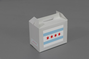 Chicago flag on white box with barcode and the color of City flag on grey background. The concept of export trading from Chicago, Illinois.