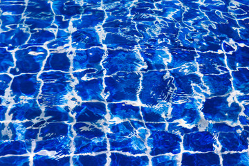 Blue color water in swimming pool rippled