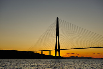 Part of the cable-stayed bridge across the strait at sunset in Vladivostok