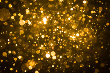 Fototapeta na wymiar Abstract blur gold sparkle bokeh