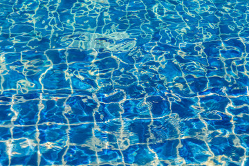 Blue color water in swimming pool rippled