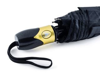 Black folded umbrella with automatic control. Black umbrella with Golden handle and button.