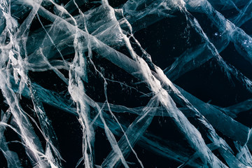 Ice with cracks in Lake Baikal in winter. Siberia, Russia.