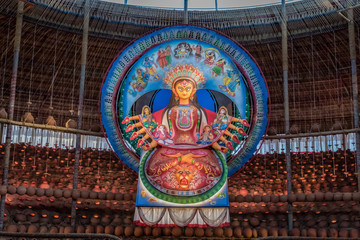 Idol of Goddess Devi Durga at a decorated puja pandal in Kolkata, West Bengal, India. Durga Puja is a popular and major religious festival of Hinduism that is celebrated throughout the world.