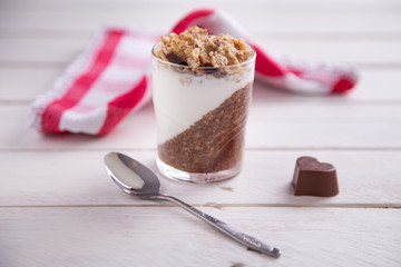 Delicious breakfast, cocoa chia pudding with yogurt and cereals