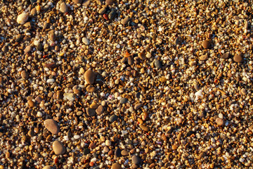 sea pebbles colored granite on the beach