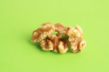 Peeled walnuts in colorful background