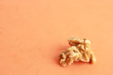 Peeled walnuts in colorful background