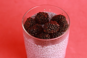 glass of chia pudding with blackberry flavor