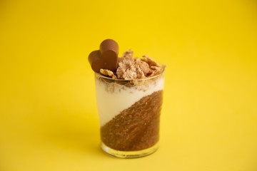 Delicious breakfast, cocoa chia pudding with yogurt and cereals