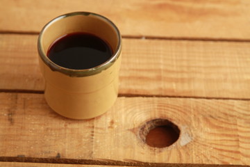 earthenware glass filled with red wine