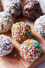 handmade multicolored chocolate candy on a wooden background