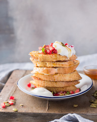French toasts (Eggy bread) with yogurt, pomegranate, seeds and honey