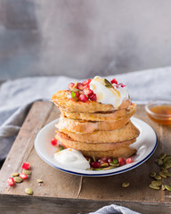 French toasts (Eggy bread) with yogurt, pomegranate, seeds and honey