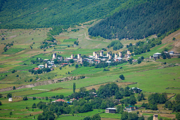 Fototapeta na wymiar Beautiful view from Svaneti, castles in old village. Peak Ushba, Mestia, Mulakhi, Georgia.