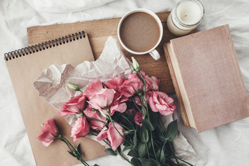 Sketchbook and coffee on wooden tray