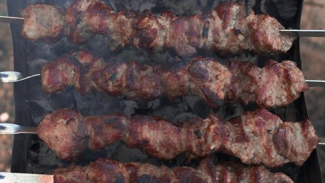 Closeup smoked bbq cooking on brazier for dinner party.