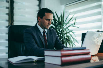 Businessman working at the office. Businessman captures notes.