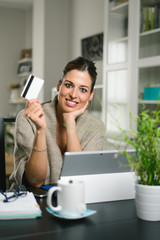 Happy woman shopping online at home