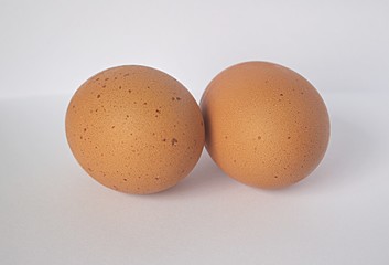 two fresh brown eggs