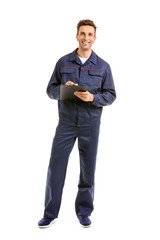 Male car mechanic with clipboard on white background