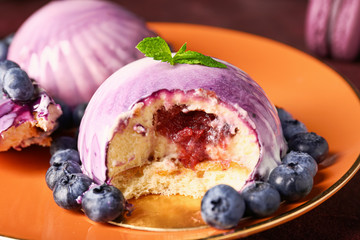 Tasty blueberry dessert on table, closeup