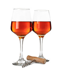 Glasses of tasty wine on white background