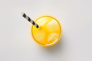 Glass of orange juice on white background