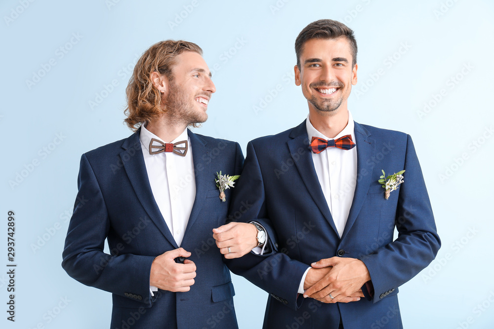 Sticker Portrait of happy gay couple on their wedding day against color background