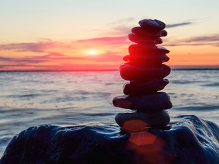 Zen Balancing Pebbles at sunset