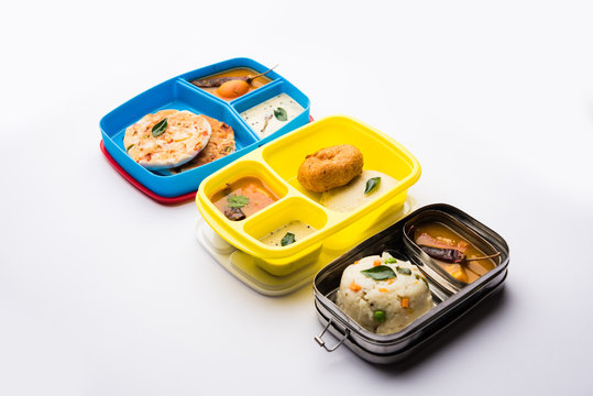 Assorted South Indian tiffin / lunch box food in group, includes idli vada, uttapam/uthappam, upma with sambar and chutney