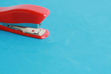 red stapler in color background
