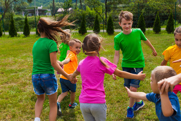Fototapeta na wymiar Children are preparing to dance holding hands