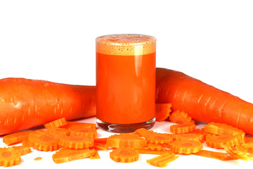 Carrot juice and carrots on a white background