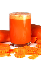 Carrot juice and carrots on a white background