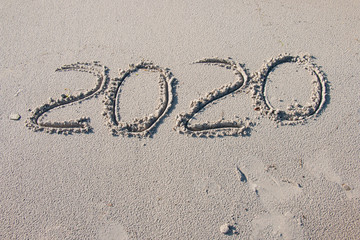 2020 handwritten on sea sand sand