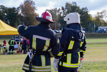 two men firefighters discuss the course of salvation
