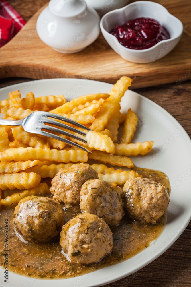 Poster Meatballs with french fries in dill sauce.