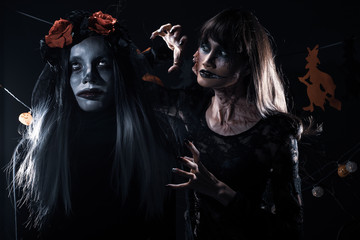 Devil White face clown and Zombie girl black hair, two ghosts possessed together over Halloween...