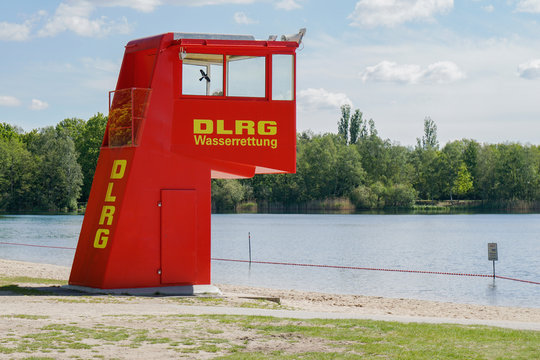 Langenhagen, Germany - May 15, 2019: Lifeguard station or tower by DLRG, which translates as German Life Saving Association, at bathing lake Silbersee.