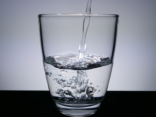 Fill the glass with water.